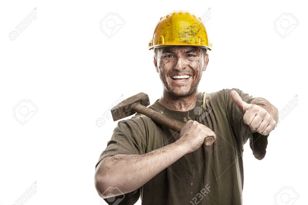 29565728 young dirty smiling worker man with hard hat helmet holding a  stock photo